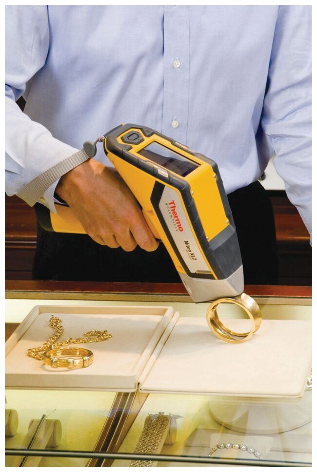 Employee using Niton Precious Metals Analyzer in the field